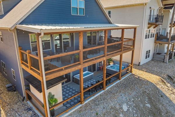 Upper deck for gathering; lower wellness porch for revitalizing.