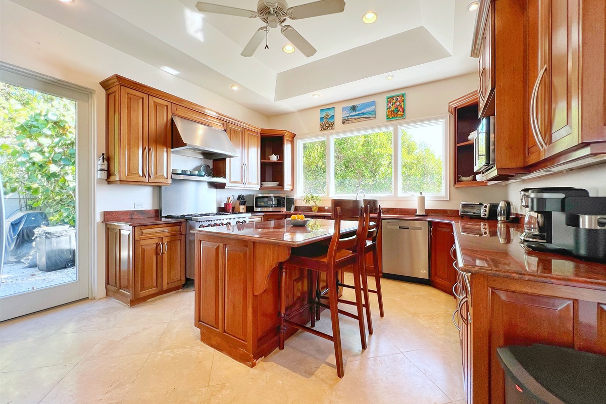 A kitchen so sleek, you might actually enjoy doing the dishes. The professional gas range will be a private chef's dream.