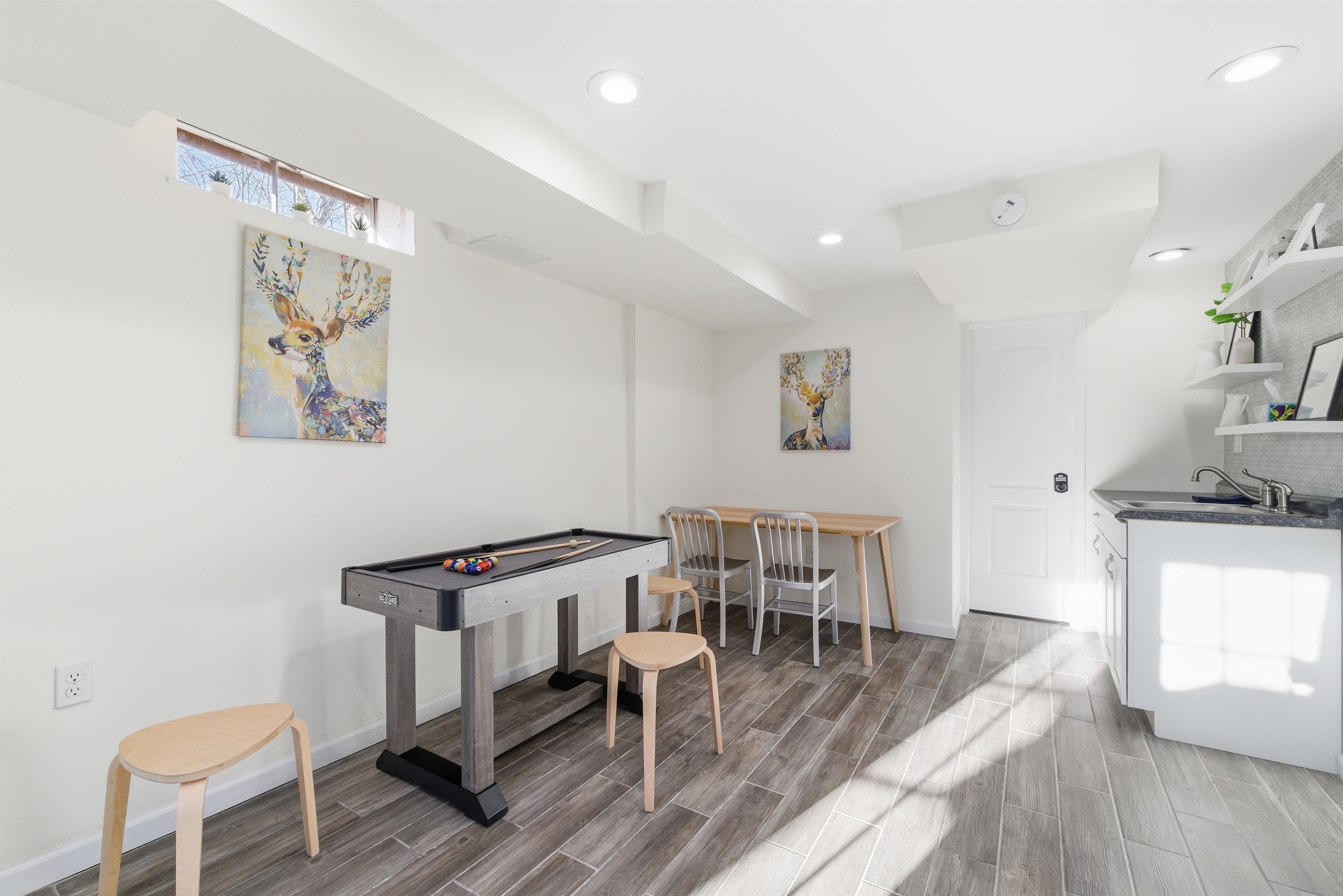 Lower level with Smart TV, PlayStation 5, foosball, mini pool table