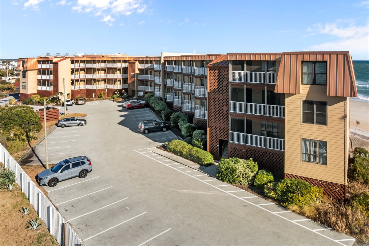 Elevated view of Topsail Dunes Building 1, with convenient on-site parking and easy beach access just steps away