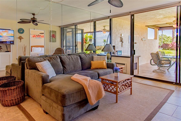 Living room with lanai access and AC.