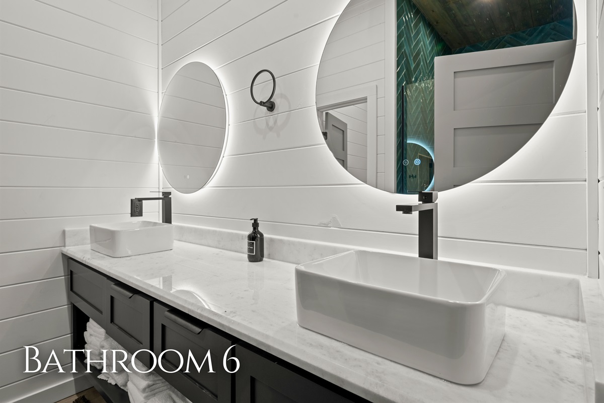 Clean lines, a double vanity, and modern lighting give this bathroom a bright and stylish feel that makes everyday routines easy.