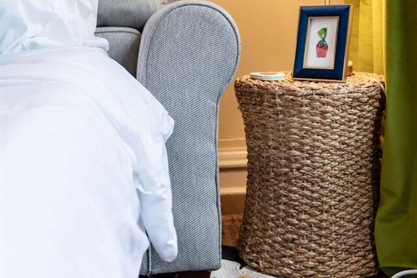 Bright and spacious living room featuring a comfortable sofa bed, perfect for relaxing or accommodating extra guests.