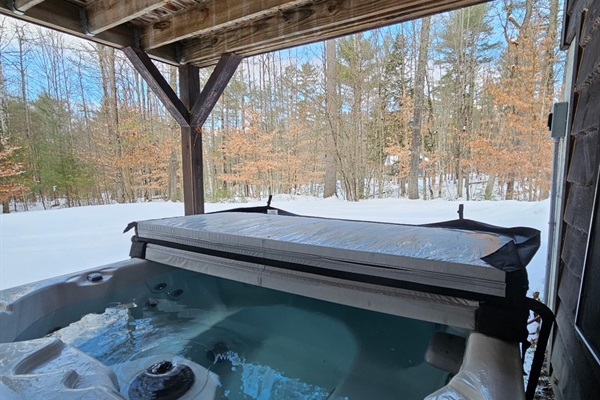 Hot tub beneath covered deck