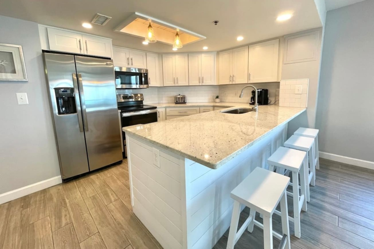 Beautiful remodeled kitchen that is stocked with cooking ware, Keurig, plates, cups, silverware, etc. No Salt/Pepper is provided 