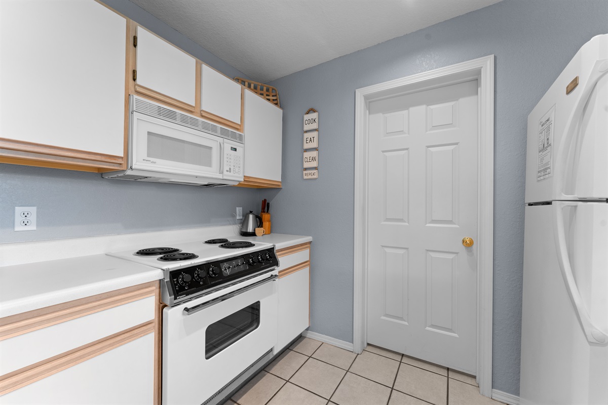 Full-size appliances and a straightforward layout make cooking feel familiar.