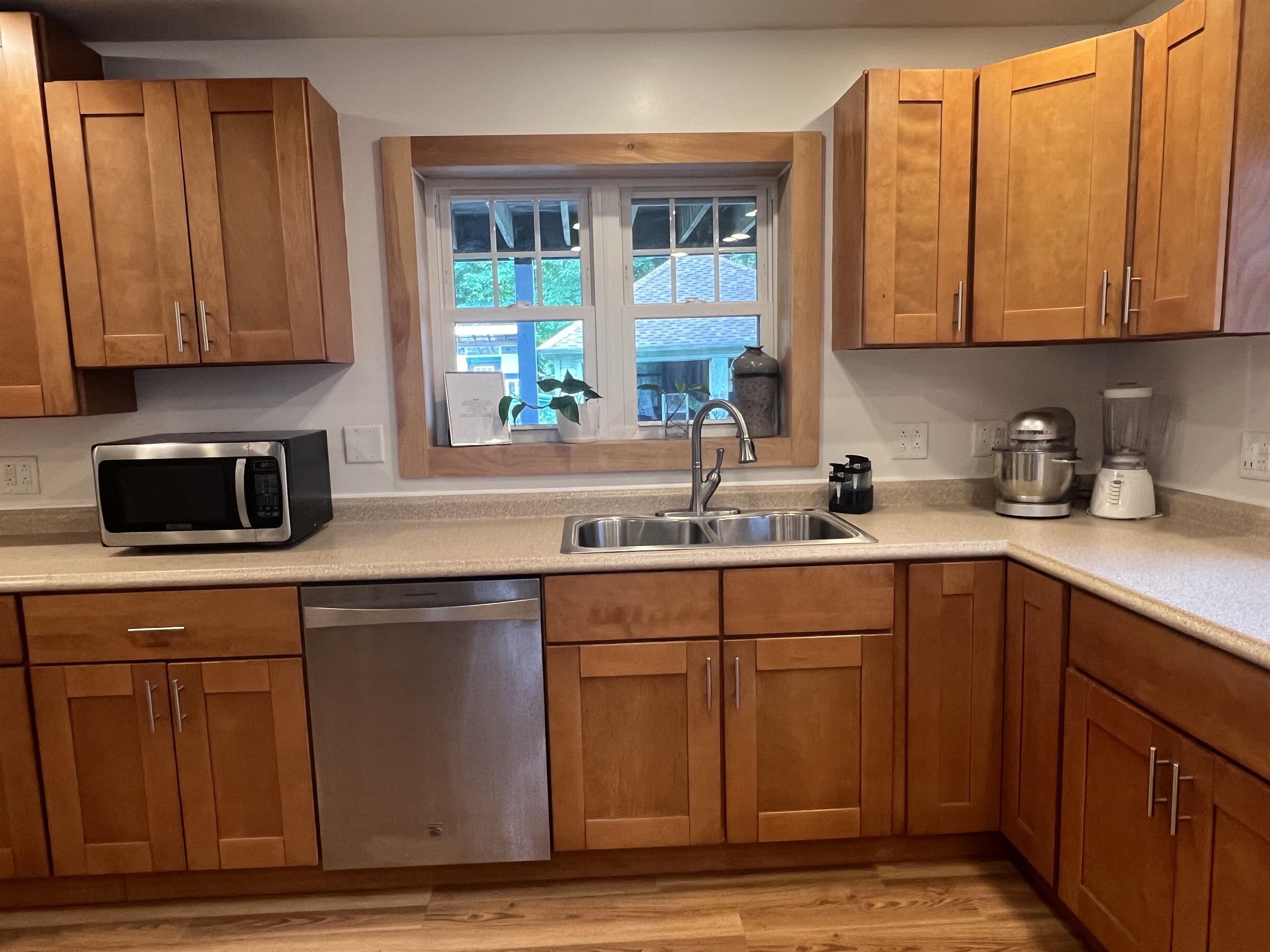Kitchen overlooking back porch and yard