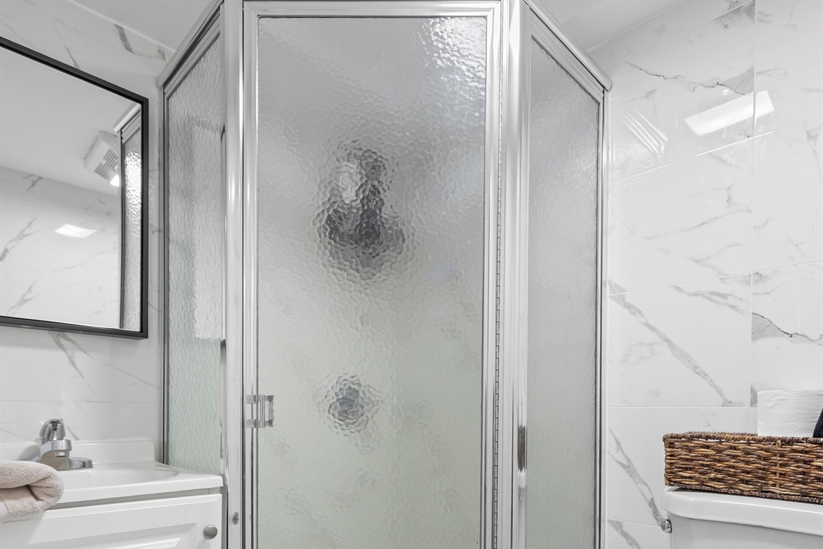 Refresh and recharge in the sleek glass shower where spa like finishes elevate everyday routines.