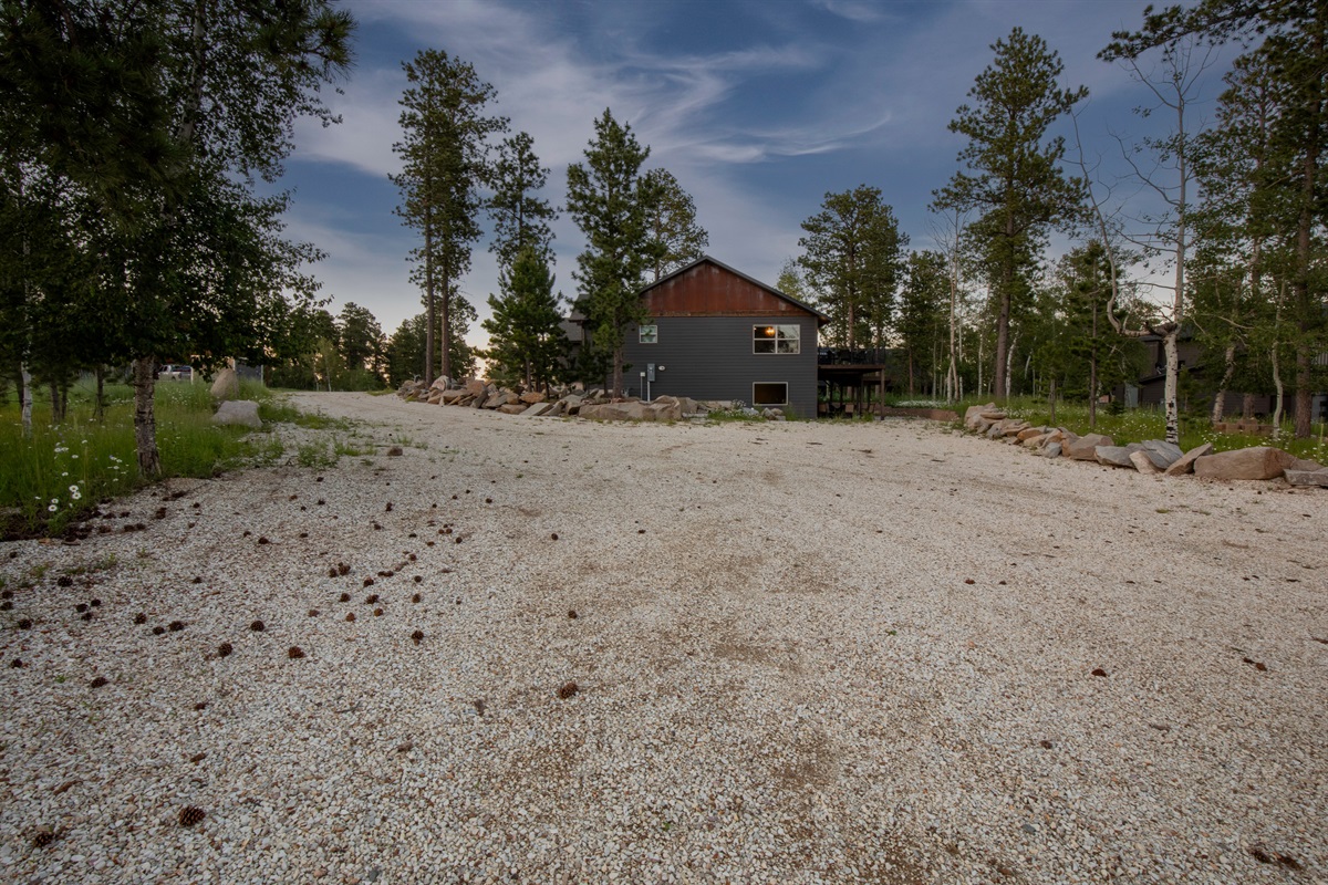 Plenty of space for trailers, ATVs, and multiple vehicles—this oversized driveway makes arrivals, unloading, and adventure prep easy and stress-free.