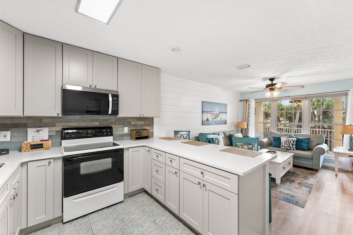Fully refreshed kitchen with brand-new cabinets and stocked kitchen with tons of cooking utensils, cookware, and everything you need to prepare meals.