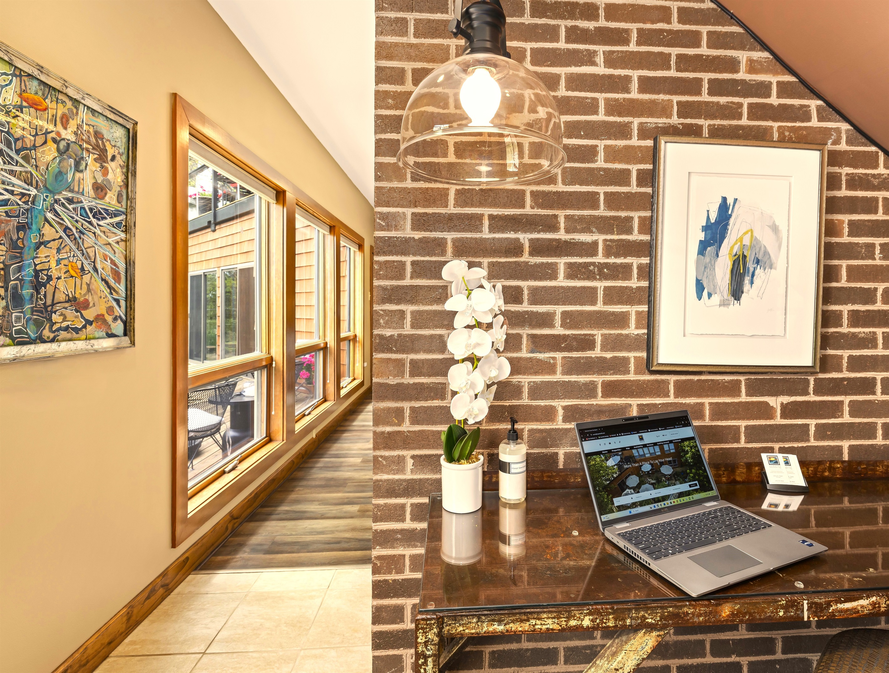 Tucked under the stairs with a lot of headroom and a garden view out the glass door to the left, pretty great place to work! Plus Cat 5, supplies, and task chair all await.