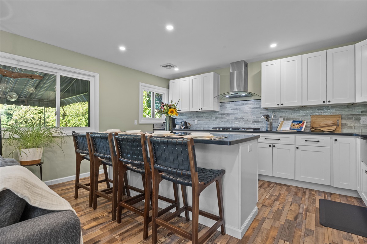 The kitchen island is the perfect spot for family time, meals, or simply soaking in the sunshine