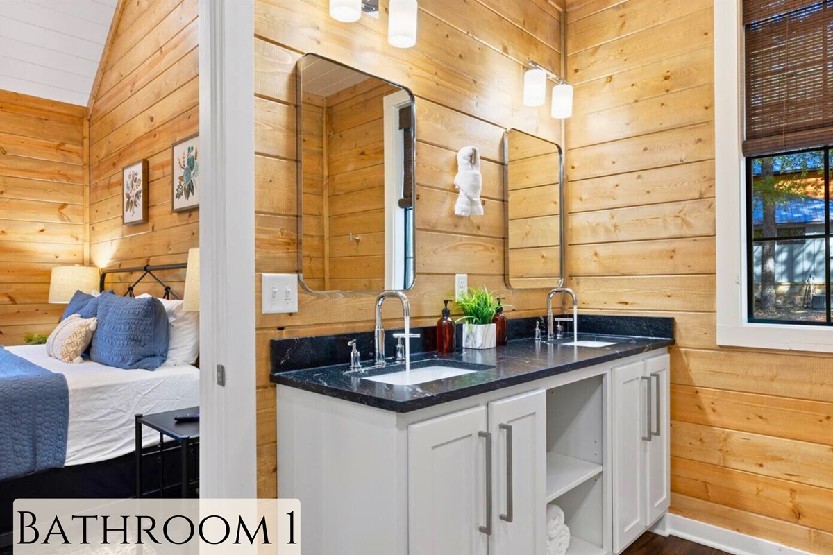 This bathroom combines modern elegance with the rustic charm of cabin living.