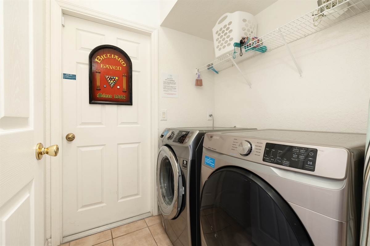 The laundry area features front loader washer and dryer free for guests to use.