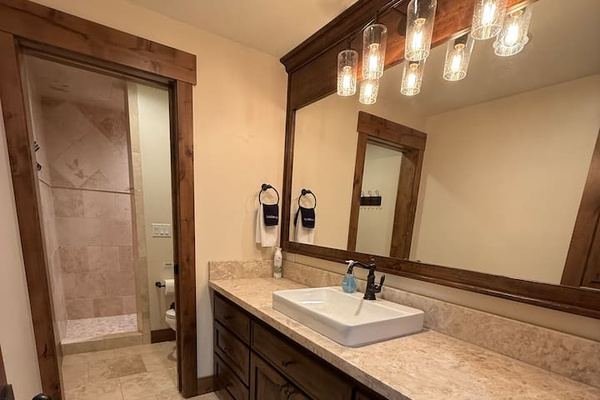 basement bathroom with walk in shower