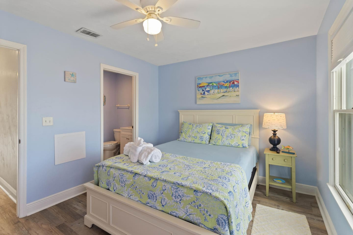 Rest easy in the queen bedroom &mdash; guests in this room wake up refreshed and ready to do it all again.