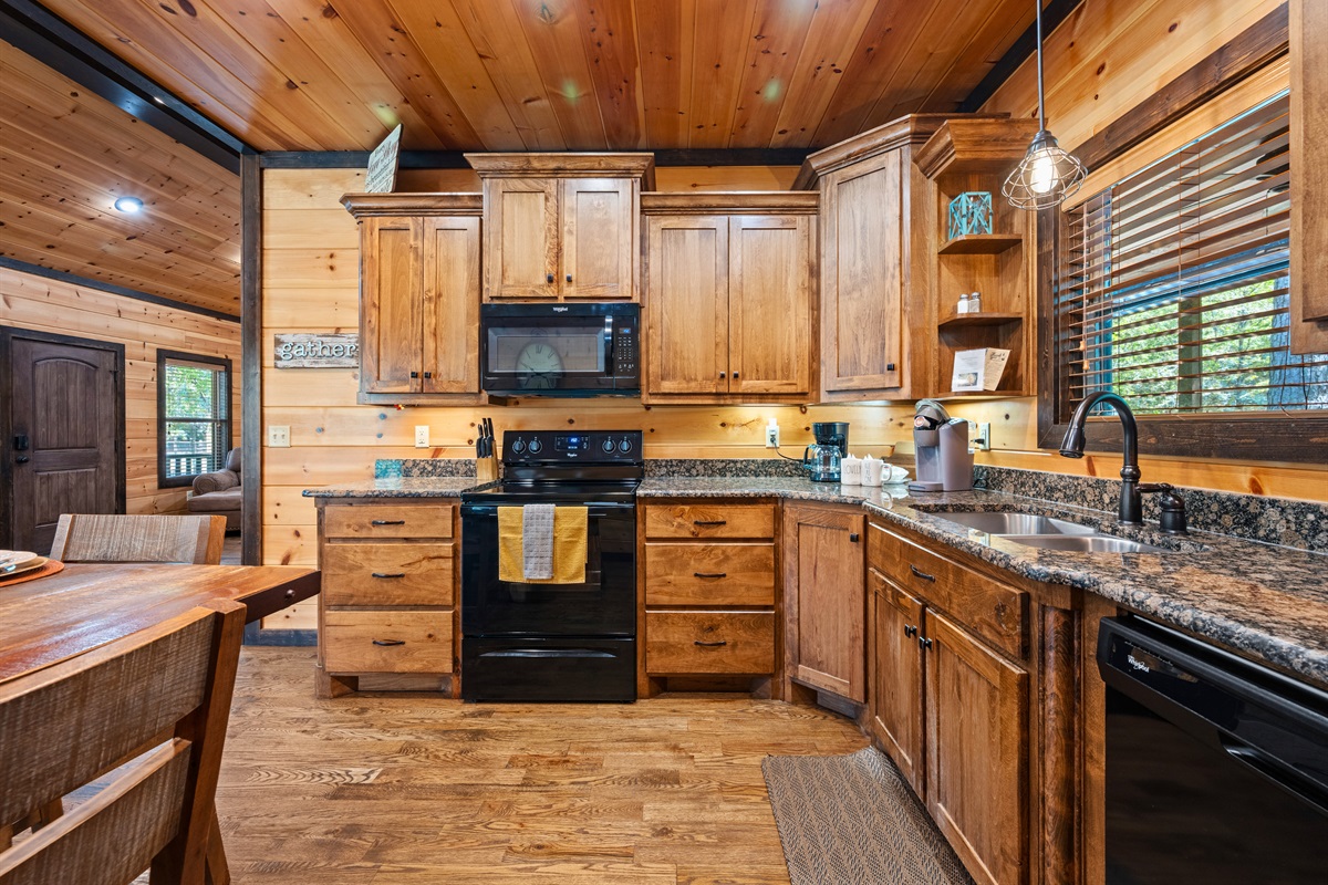 Beautiful kitchen with plenty of counter space and cabin-style cabinetry.