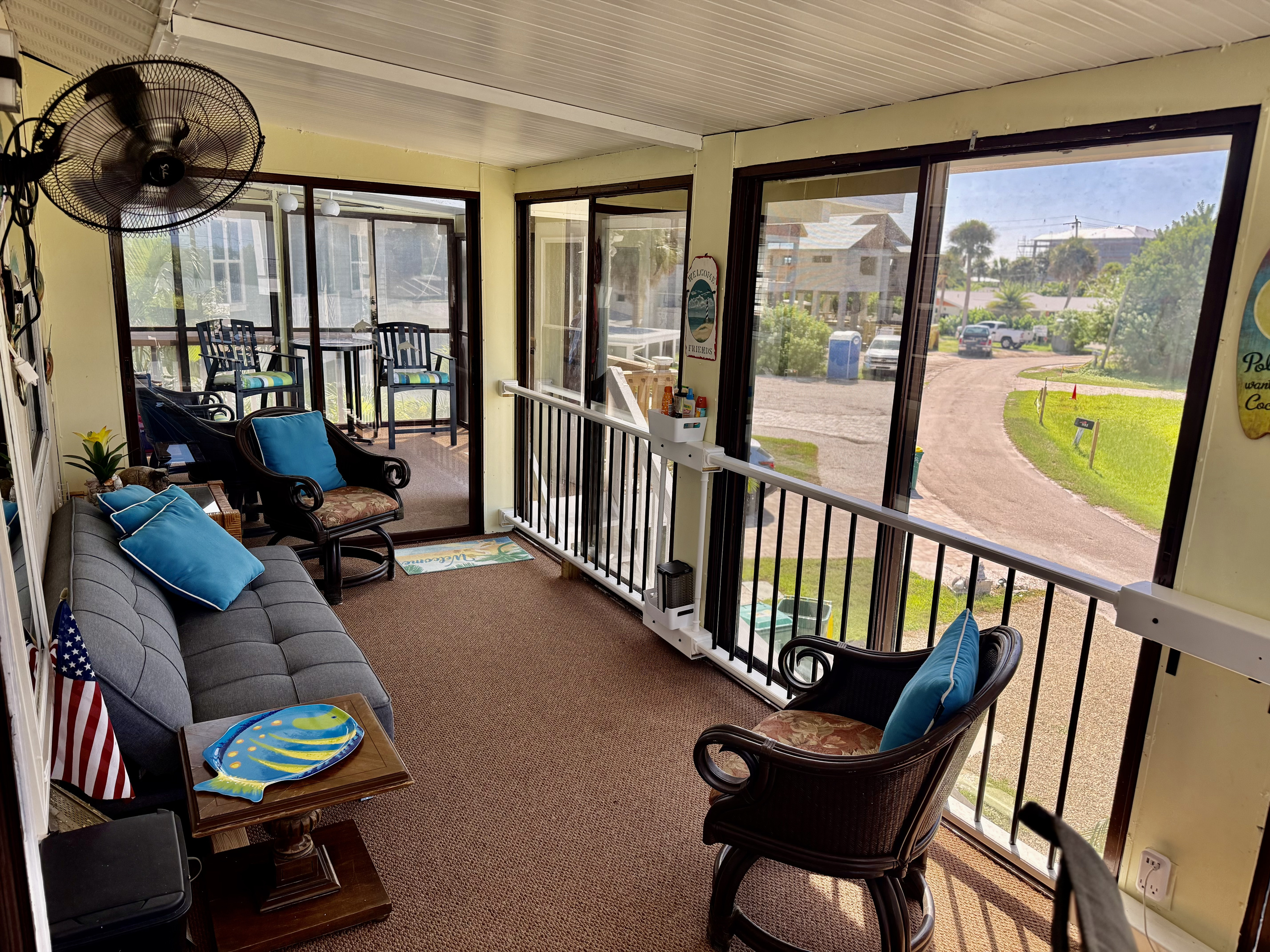 Large private second floor lanai with seating and outdoor desk with computer to work from home.
High Tide
