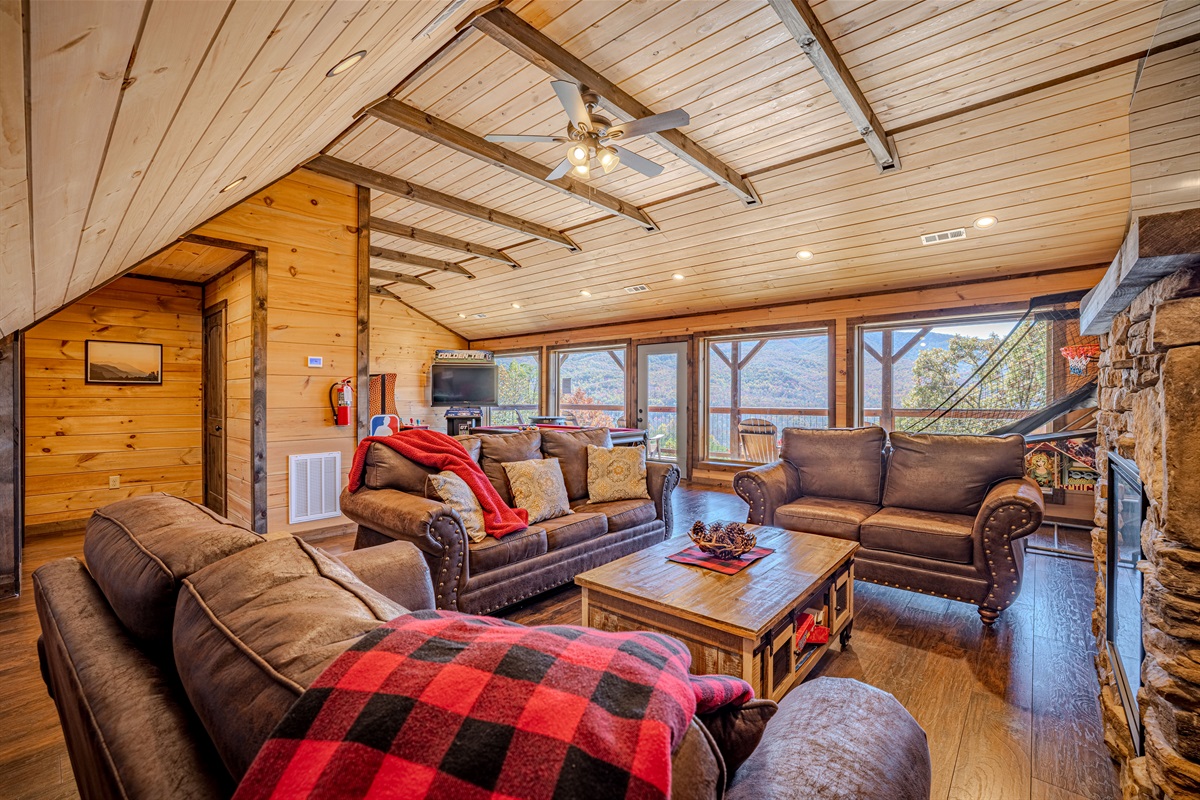 Comfortable lounge seating in the game room with huge picture windows.