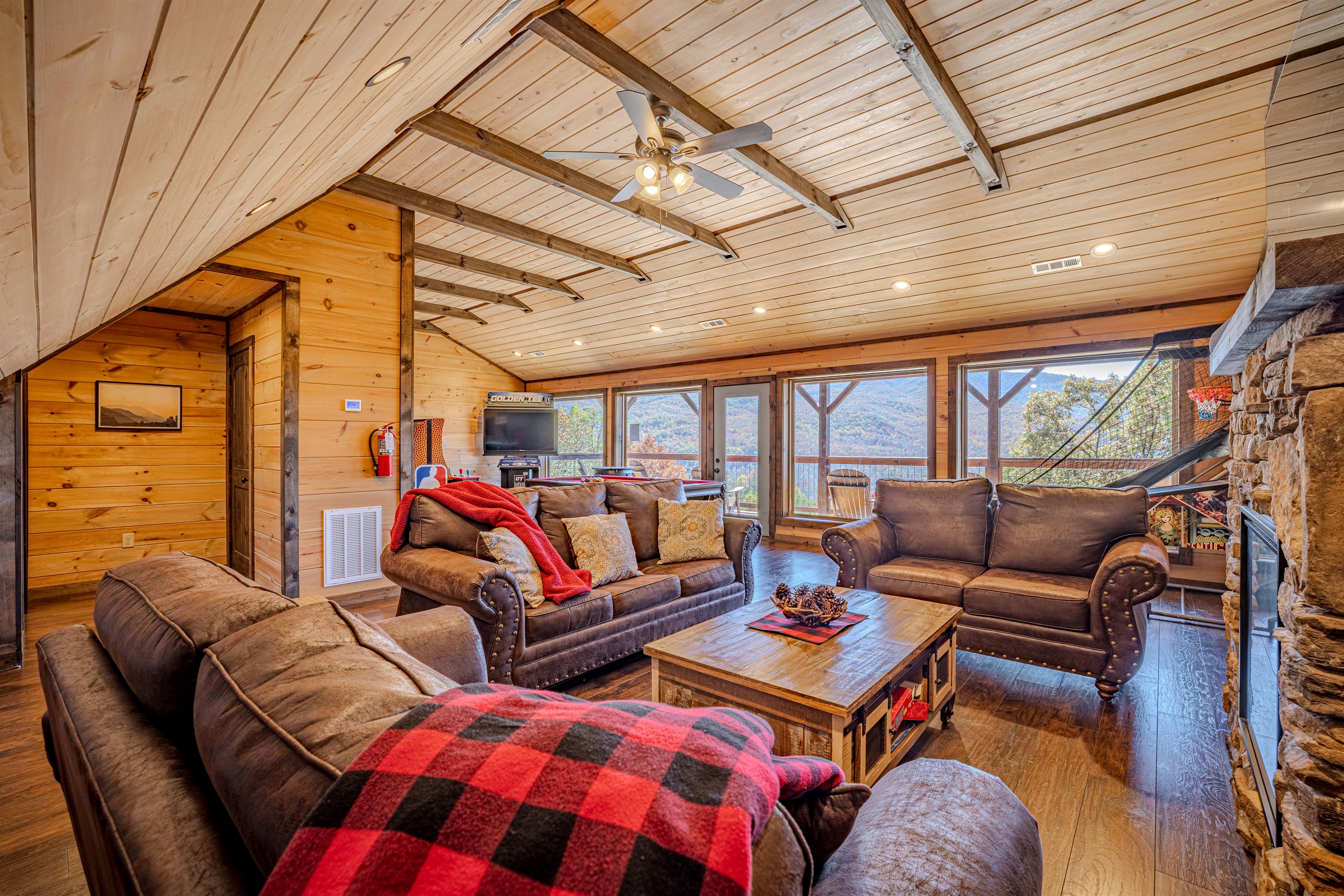 Comfortable lounge seating in the game room with huge picture windows.