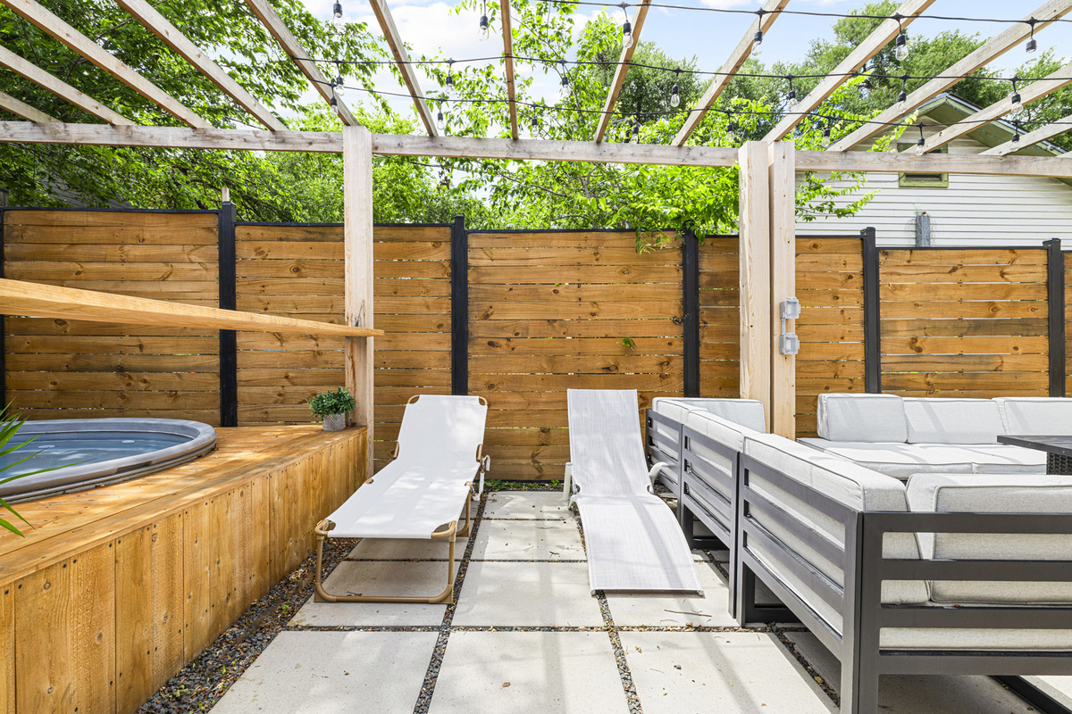 Unwind in style with a private hot tub surrounded by lush greenery!