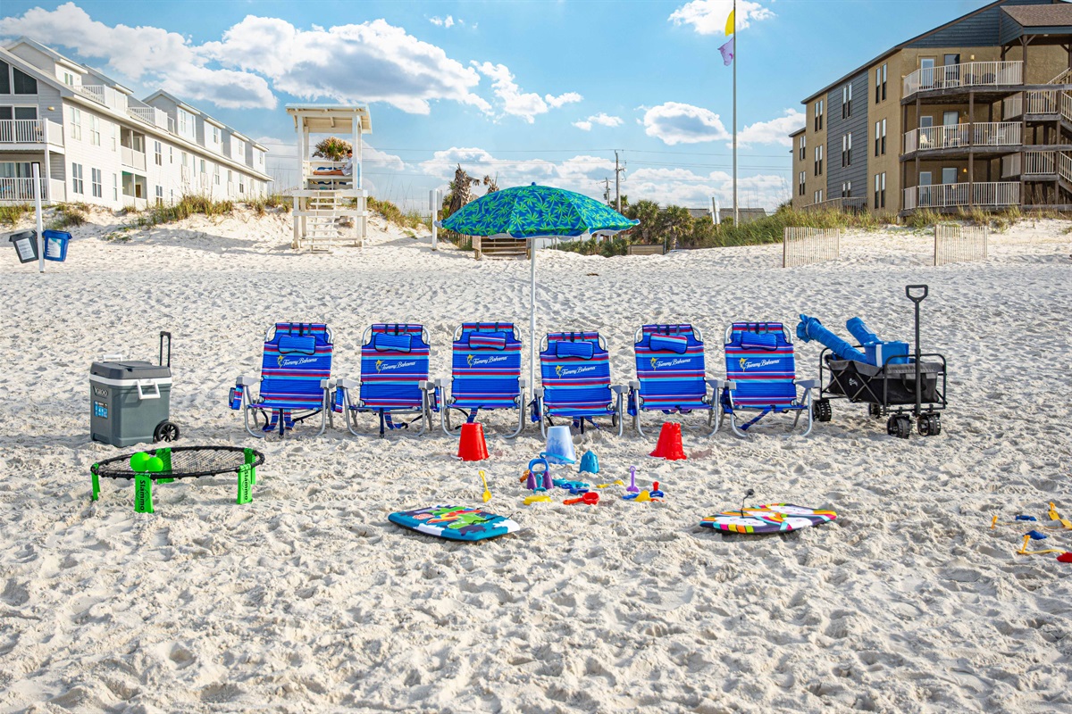 Beach chairs, umbrella, wagon, toys, kid boogie boards, and cooler provided.