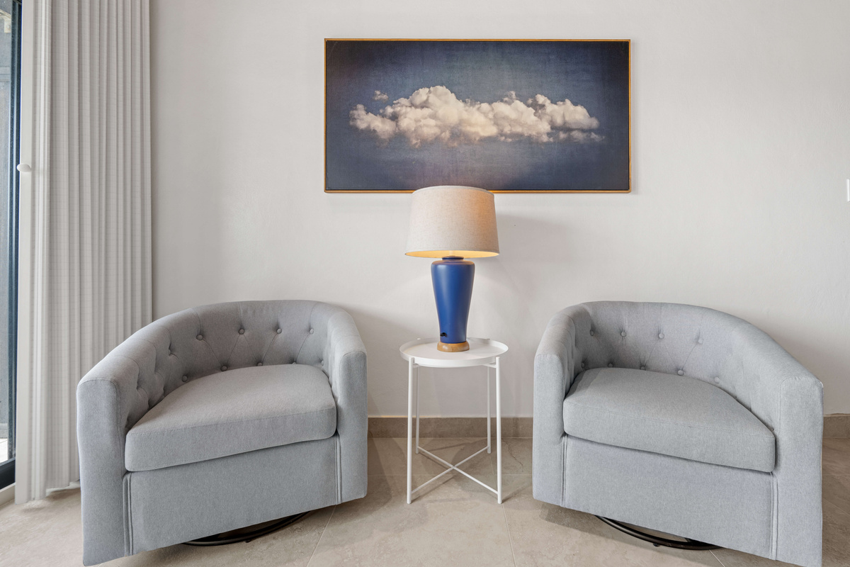 Private sitting area in the primary suite &mdash; perfect for relaxing with a book or morning coffee.