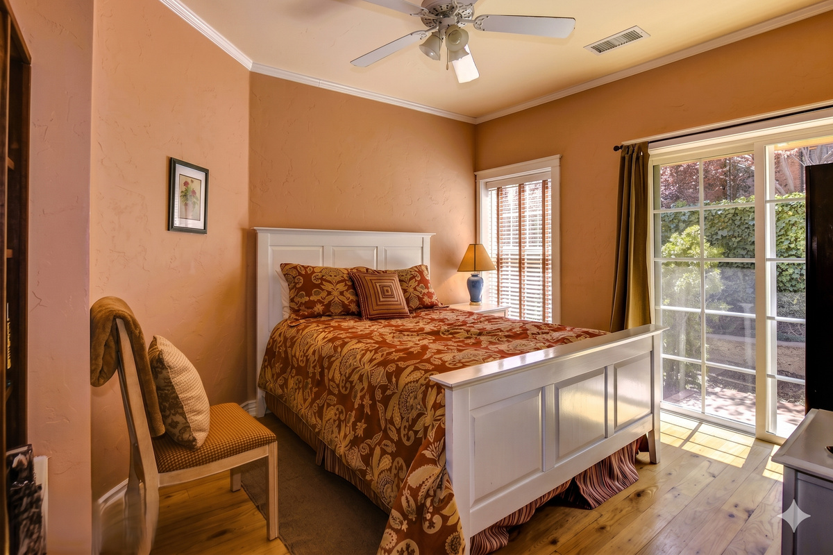 Enjoy a peaceful night's sleep in the inviting secondary bedroom, complete with a plush queen-size bed and soft linens.