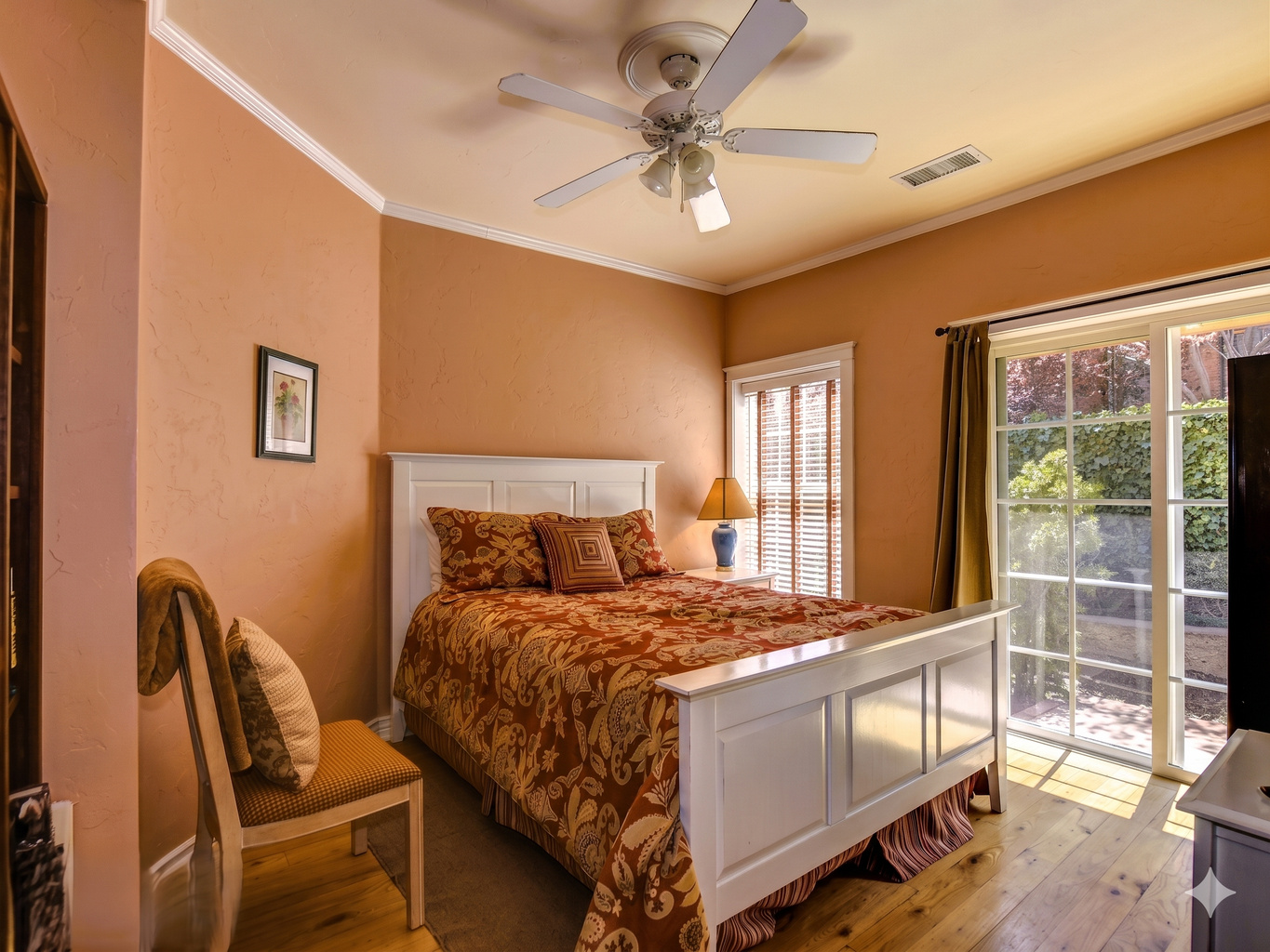 Enjoy a peaceful night's sleep in the inviting secondary bedroom, complete with a plush queen-size bed and soft linens.