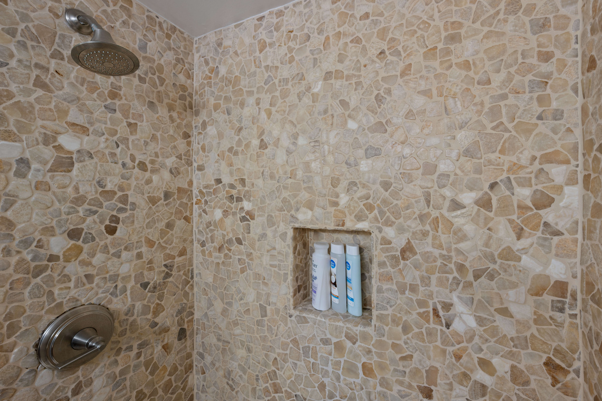 Refresh and recharge in the spacious walk-in shower after a day in the sun.