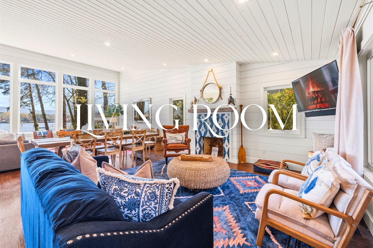 Step into the living room where cozy seating and warm natural light create an inviting space to gather and unwind.