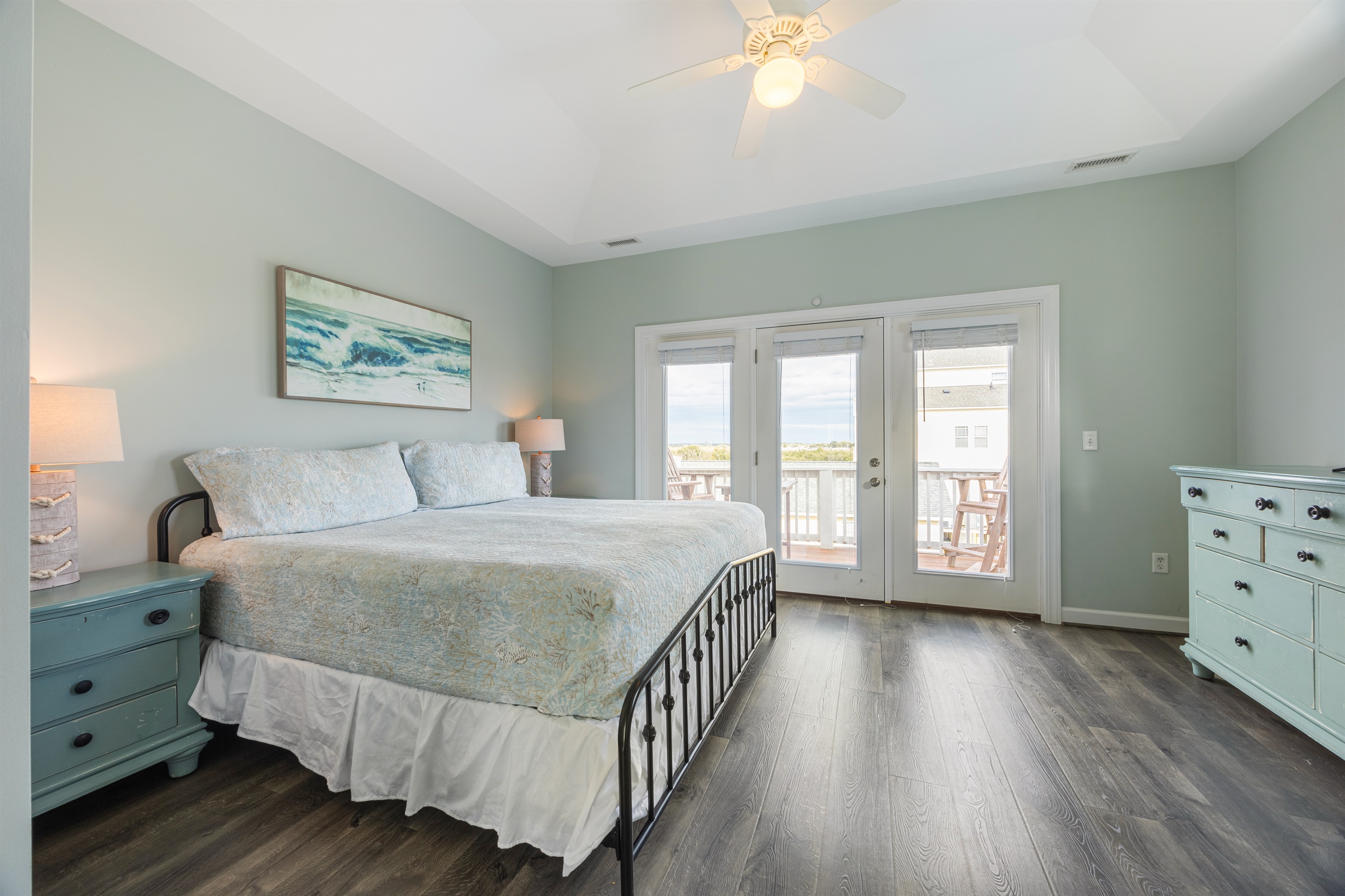 Spacious king bedroom opens to a private balcony—perfect for morning coffee or evening unwinding