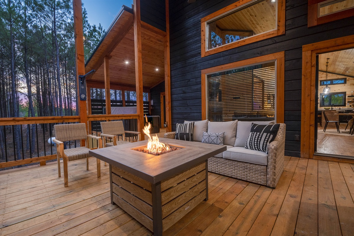Outdoor living at it's finest! Hot tub, cozy seating around the gas fire pit, outside dining table and grill!