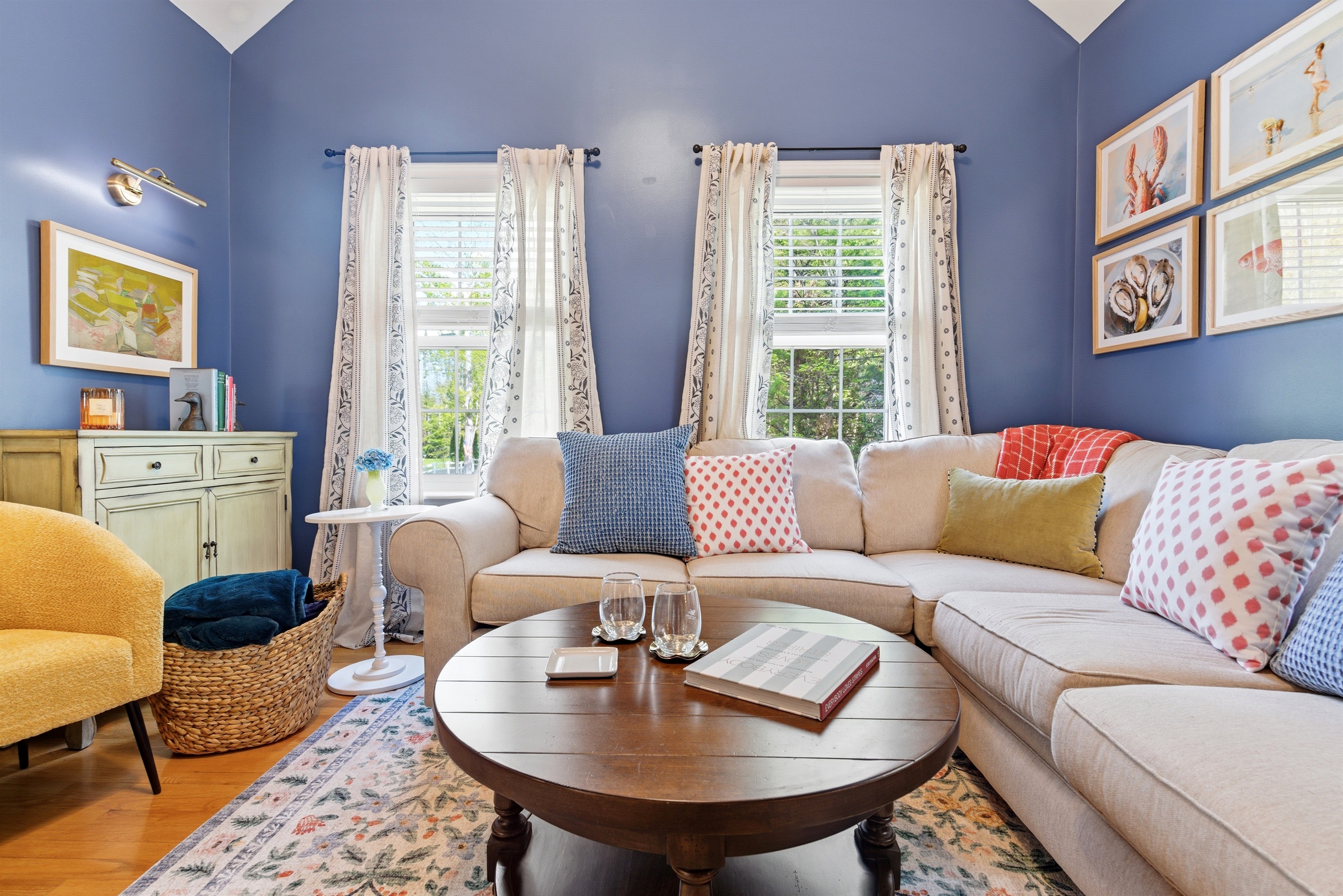 View of the living room showcasing its spacious layout, comfortable seating, and warm, inviting ambiance.