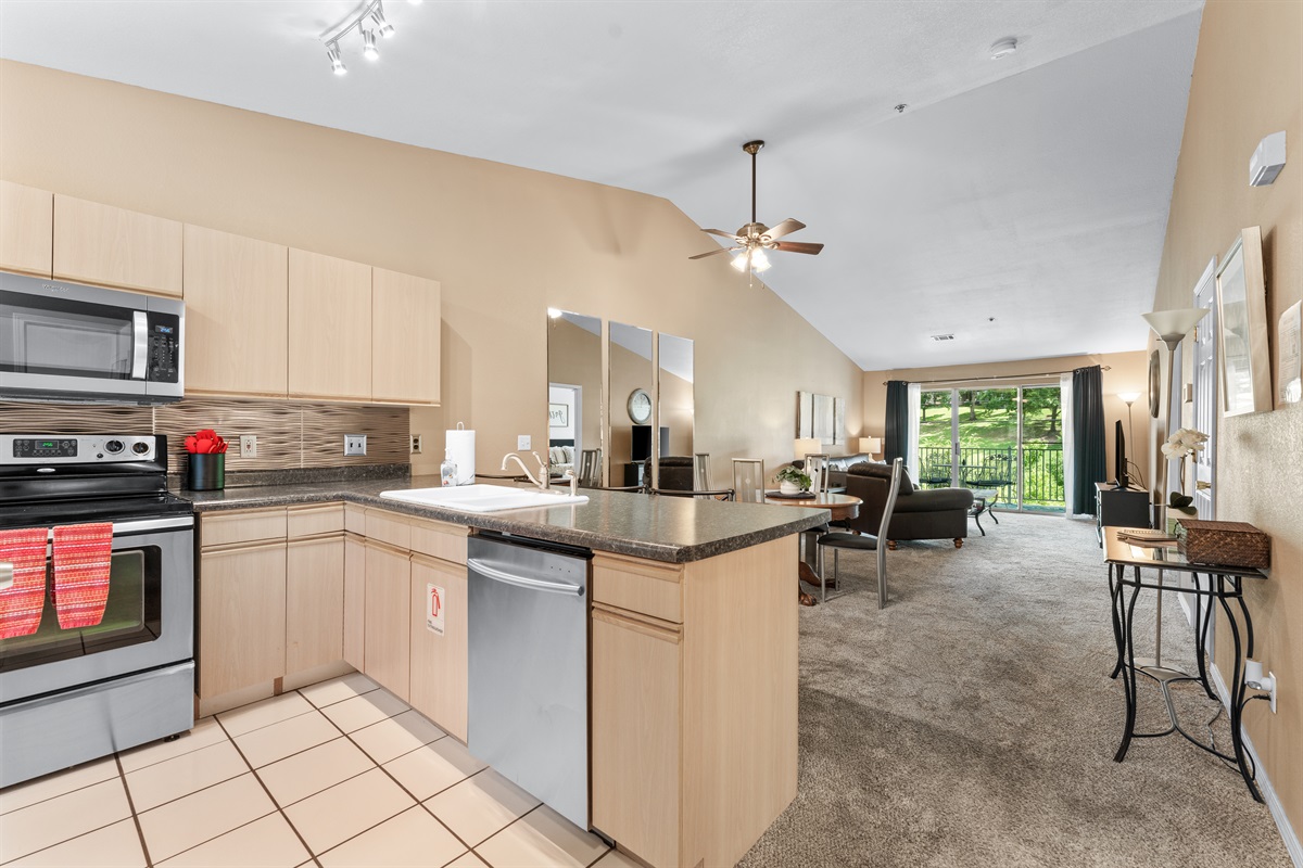 Cook, chat, and stay connected in the open kitchen with clear sightlines to the dining area and living room.