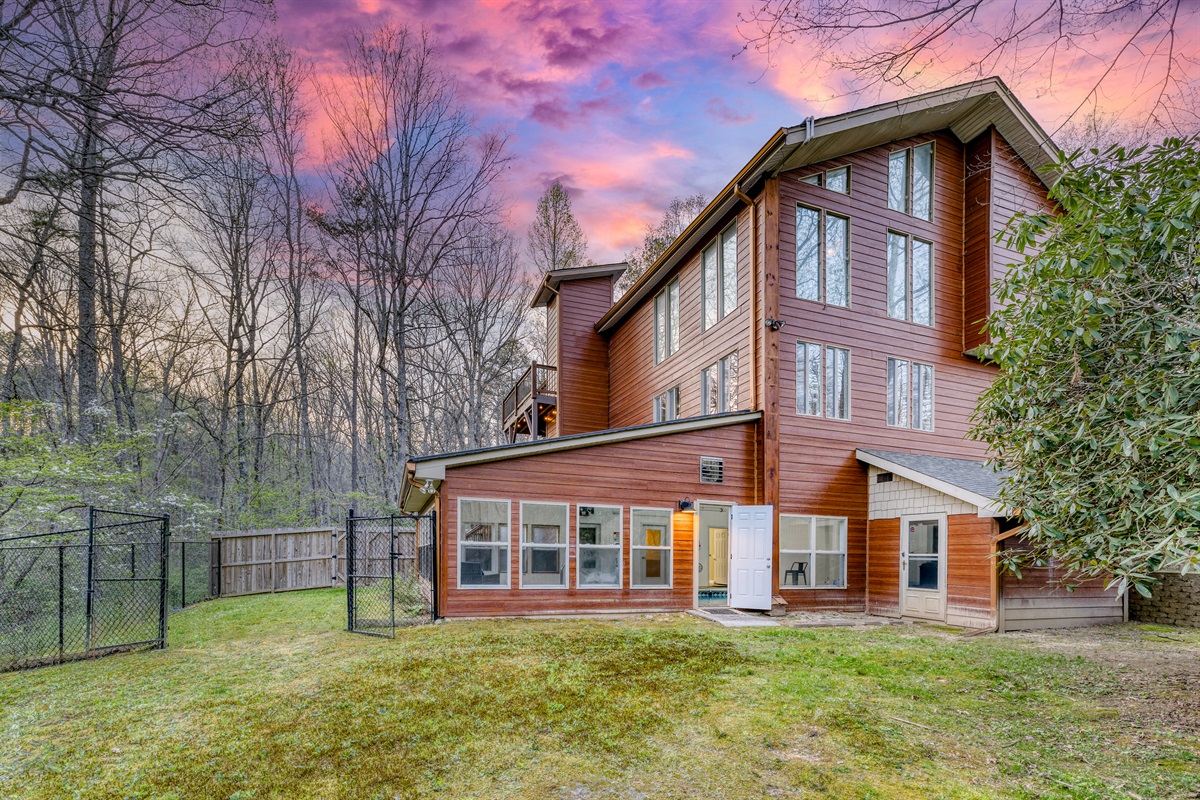 View of house showing indoor pool and fenced in back yard