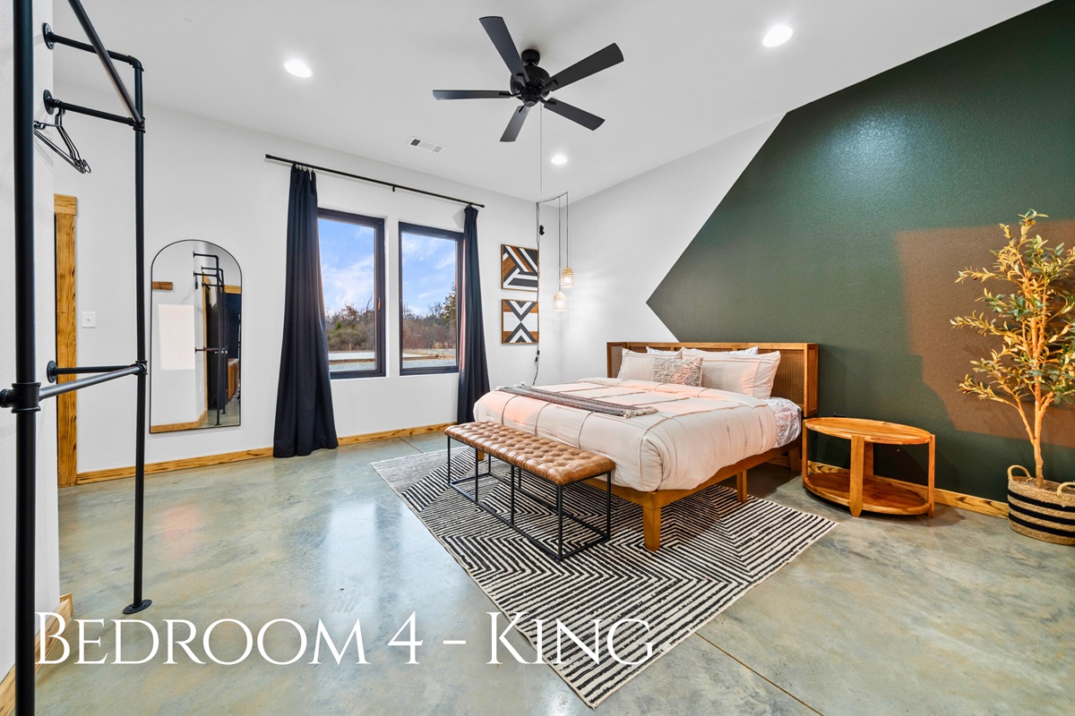 Bedroom 4 is another spacious king suite, offering a comfortable setup and soothing tones for a great night&rsquo;s sleep.