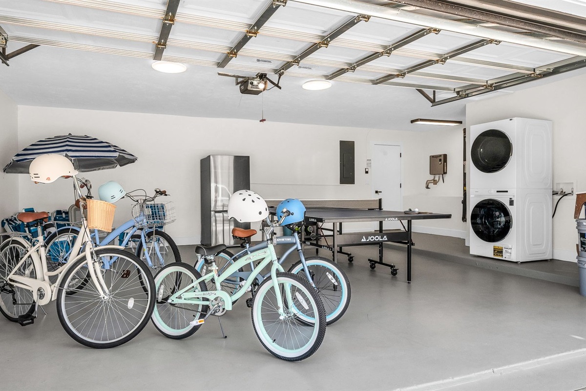 Enjoy a garage filled with extras — from a full-sized Ping Pong table, bikes, and fitness gear to beach chairs, umbrellas, towels, and a cooler — everything you need for fun at home or a perfect day by the water.
