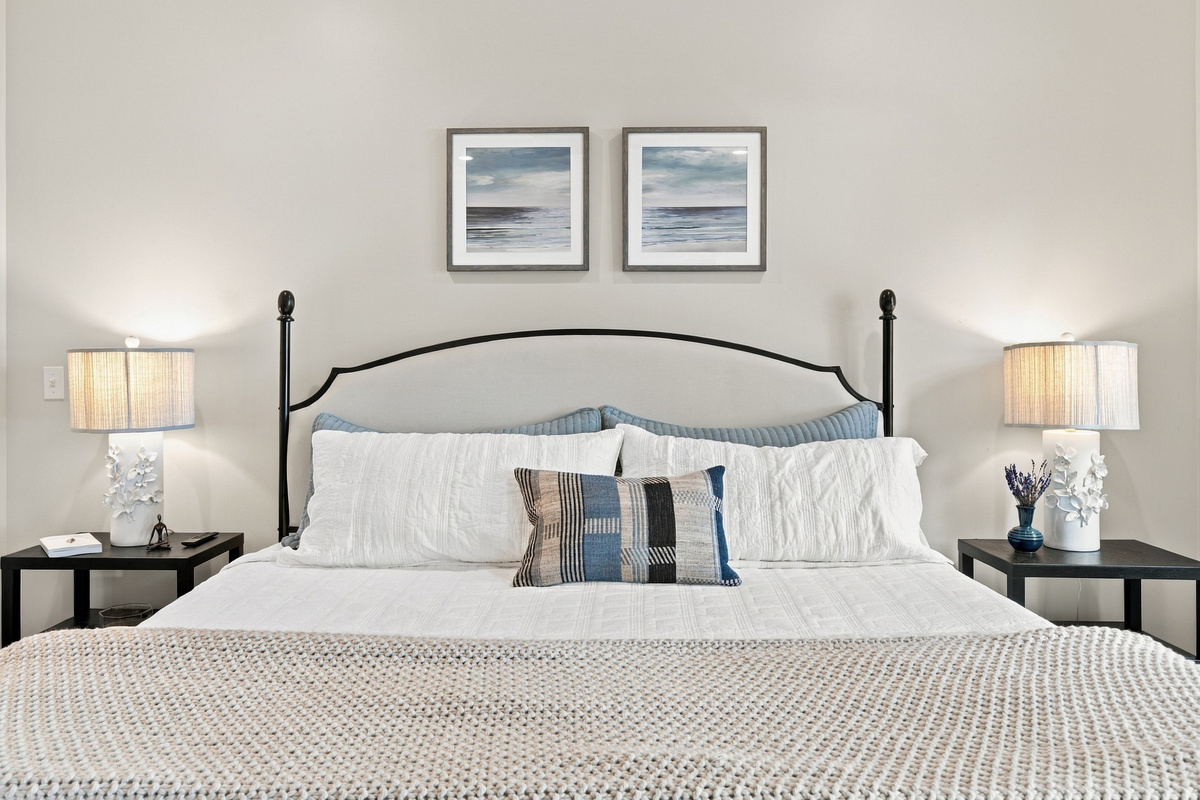 Enjoy the primary bedroom on the main floor with a cozy king bed, memory foam mattress, ceiling fan and extra day bed with trundle for the littles. 
