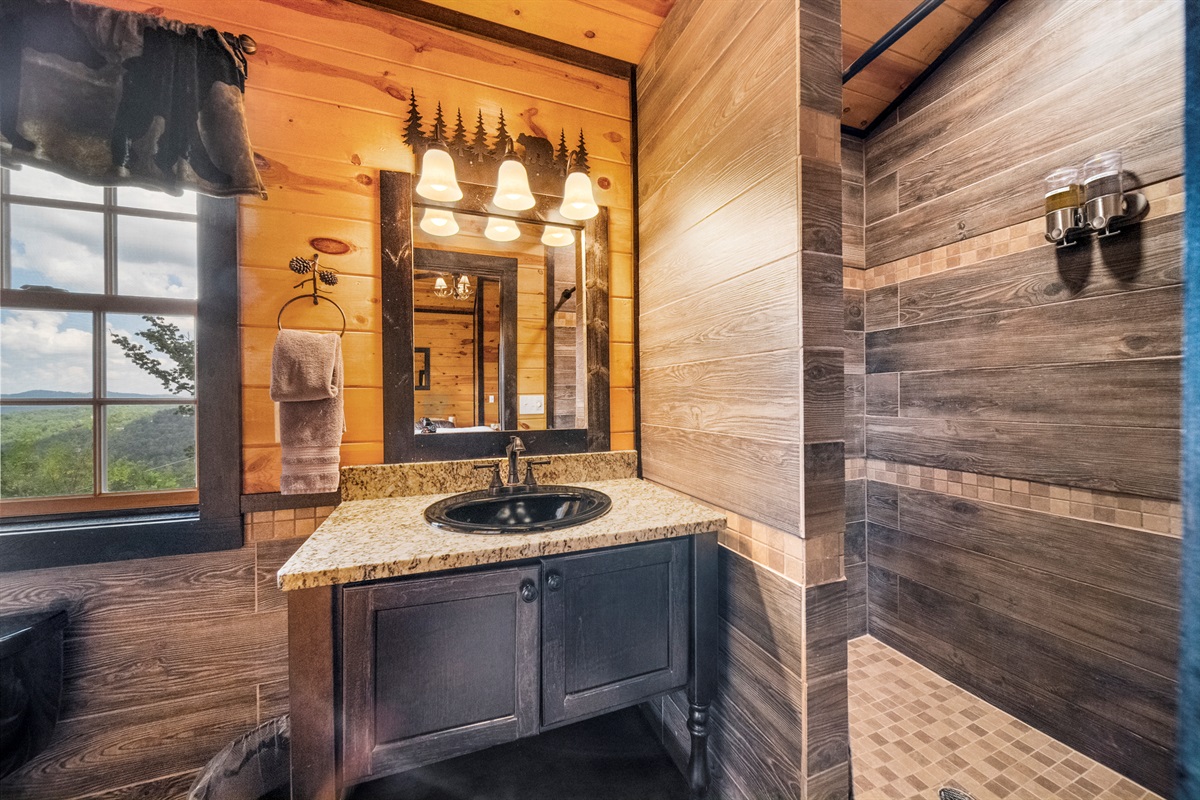 The Master Bath ensuite has a shower that is big enough for 2. There is body soap and shampoo too. There is a makeup mirror and hair dryer under the sink for your convenience.