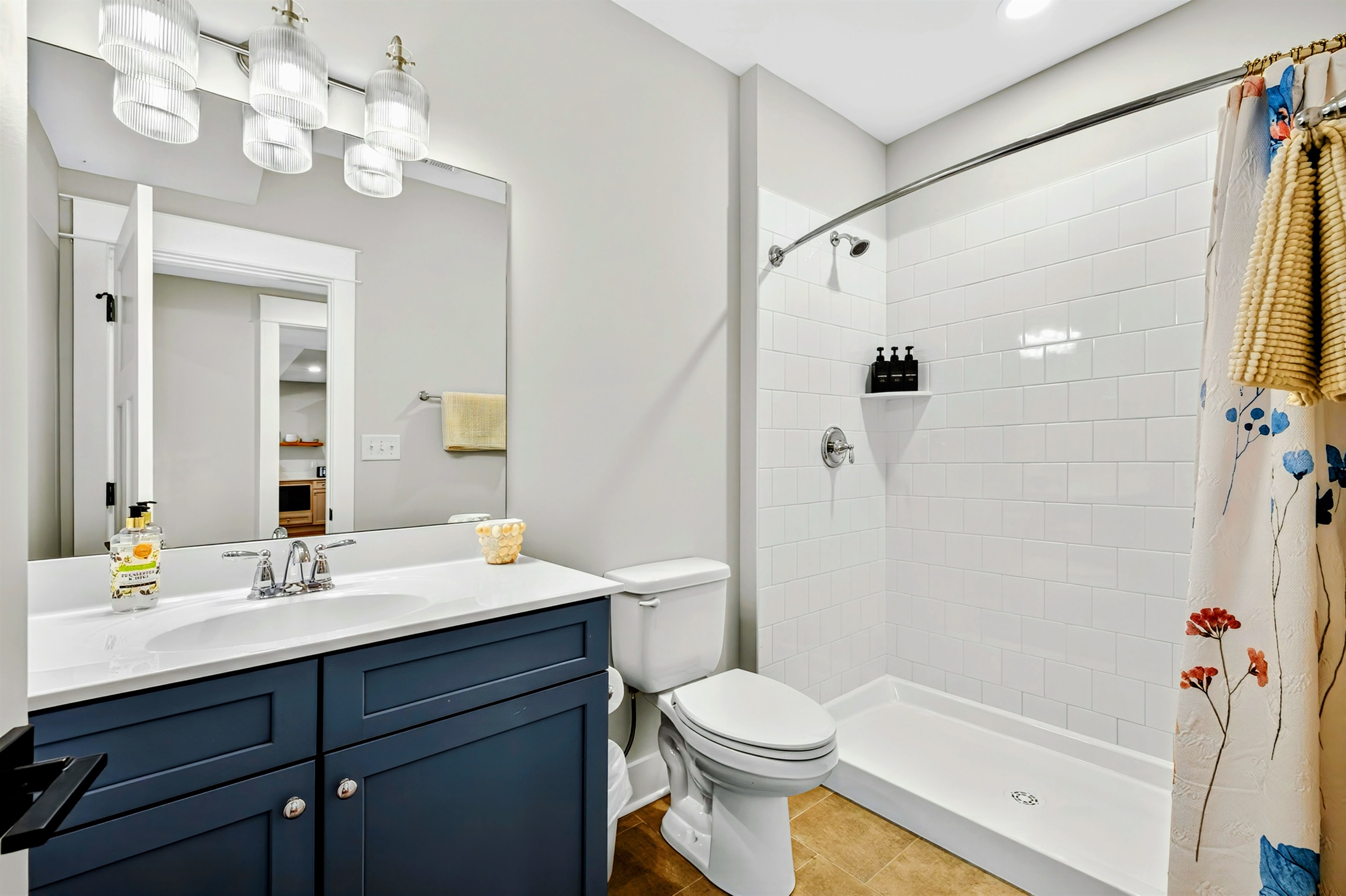 Of course, the hydrangea king suite has an adorable en-suite full bath also with a floral pattern also done in soothing blues and grays. Every detail is well thought out at Blueberry Bay.