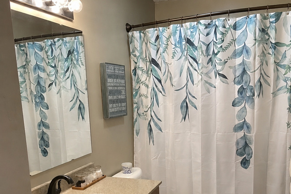Bathroom with botanical shower curtains