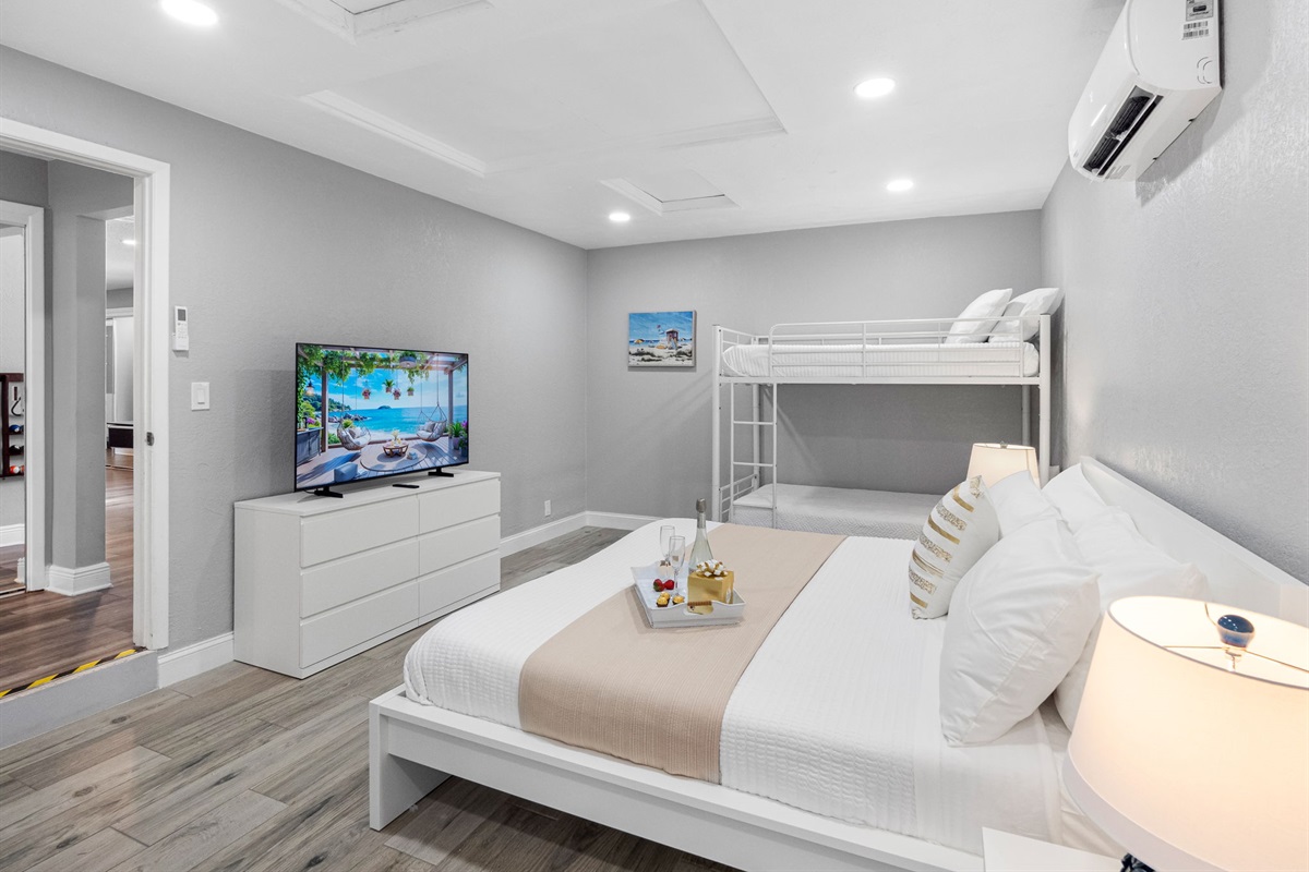 Kids will love climbing into the top bunk while adults can enjoy the comfort of the king bed just a few steps away.
