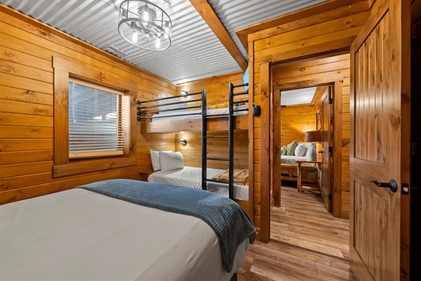 Spacious bunk + queen bedroom. Smart TV, fan, noise machine. Personal light  and USB outlet on each bunk