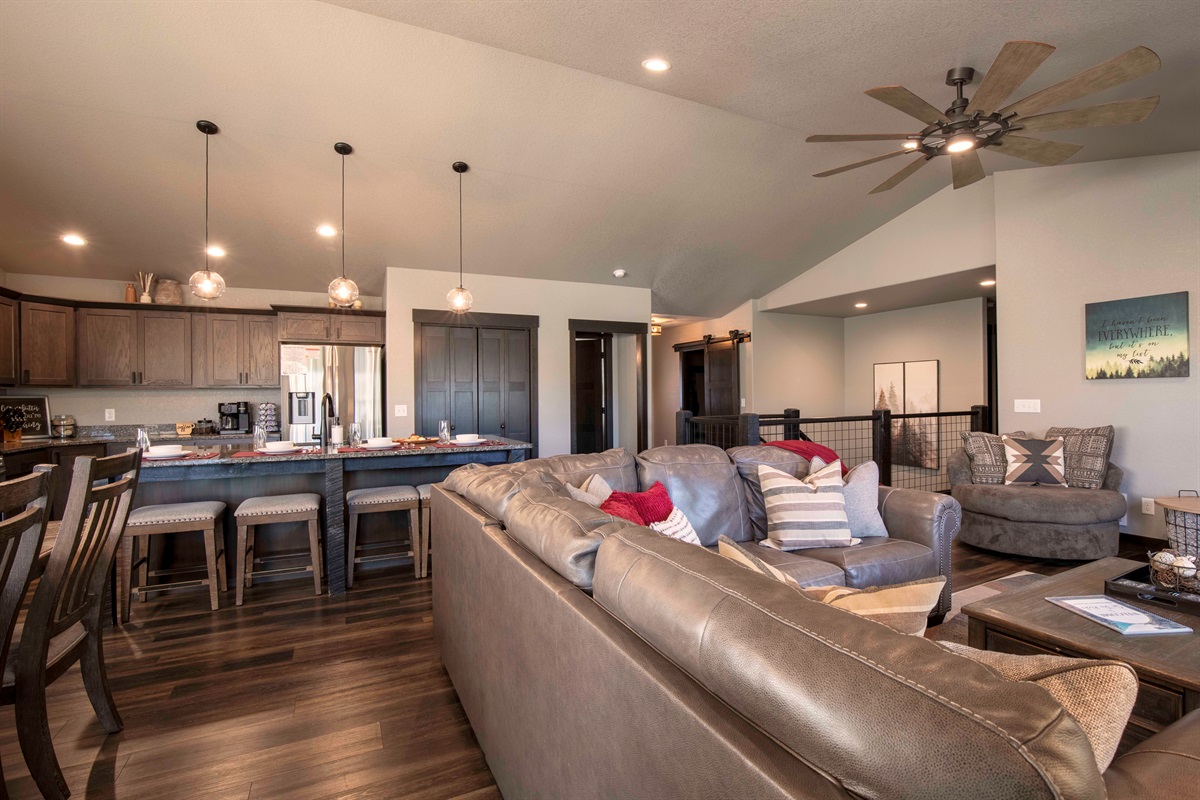 Picture yourself settling into the cozy living area at "On The Rocks," sinking into the plush leather sofa as the fireplace casts a warm glow. 