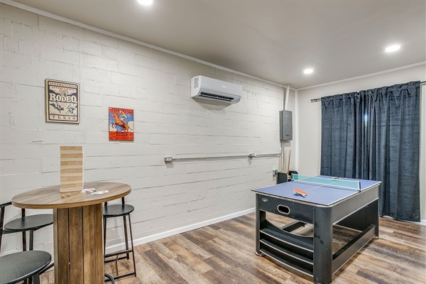 Game room with ping pong table, AC unit, and room to gather and play