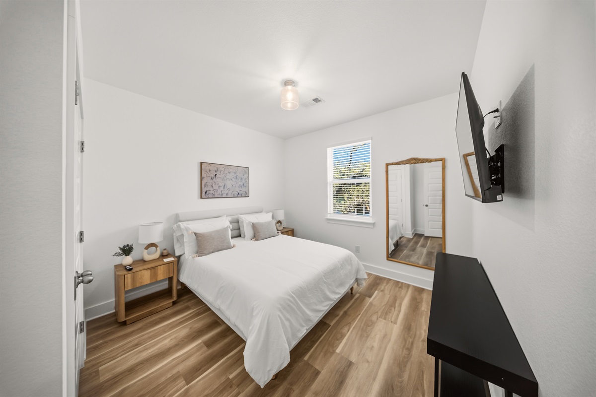 Queen bedroom with clean and inviting design