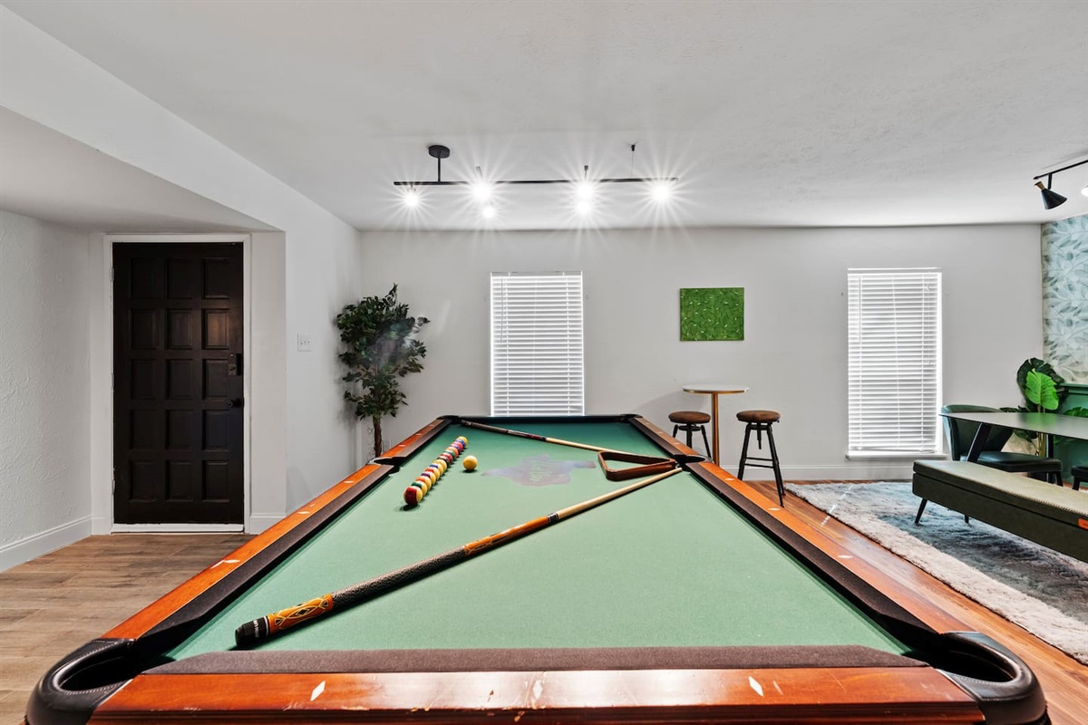 Massive game room with plenty of space for pool, seating, and game night memories.