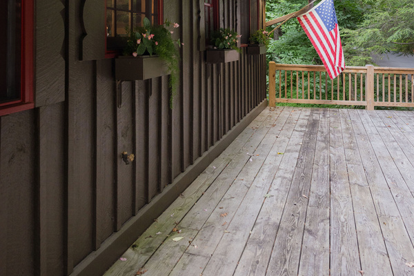 A warm welcome awaits, with seasonal flower boxes, our front porch flag, and a peaceful woodland setting.