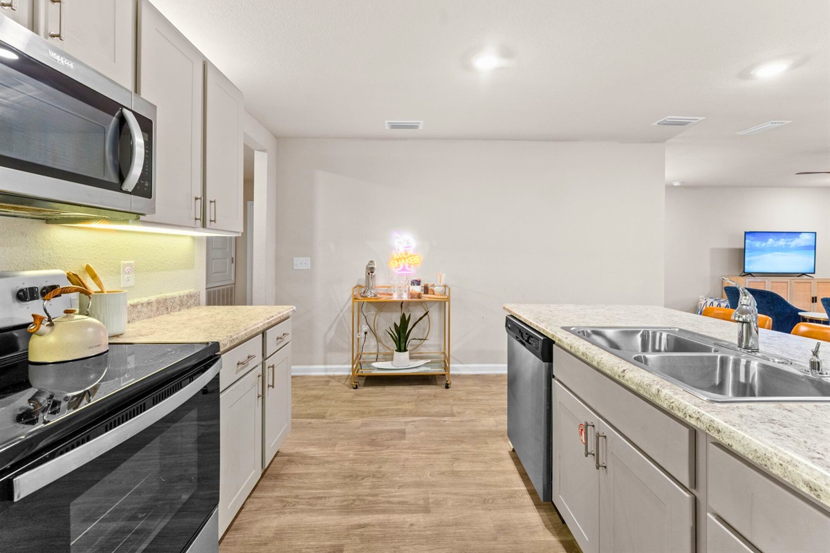 A closer look at the kitchen shows modern finishes and everything you need to cook, serve, and gather with ease.